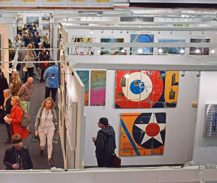 Visitors and art on display at the Private View of Fresh: Art Fair 2019 at Cheltenham Racecourse.