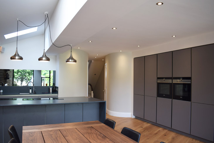 Contemporary kitchen extension with curved walls to link to the rest of the house.