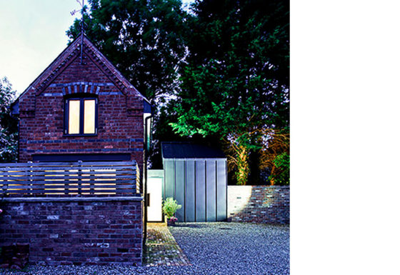 A contemporary extension to a small coach house.