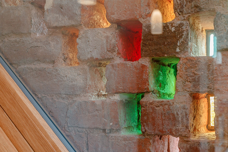 Original 'hit and miss' brickwork re-used with the creative use of coloured glass.