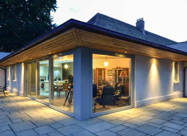 Contemporary extension to curtilage listed coach house in the Cotswolds