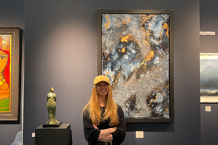 Artist Amy Magee with one of her originals from her Neptune collection. Amy is represented by the Clifton Fine Art Gallery.